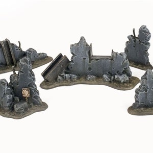 May include: Set of eight grey and brown concrete building ruins for tabletop gaming. The ruins are various sizes and shapes, with some featuring broken windows and other details.
