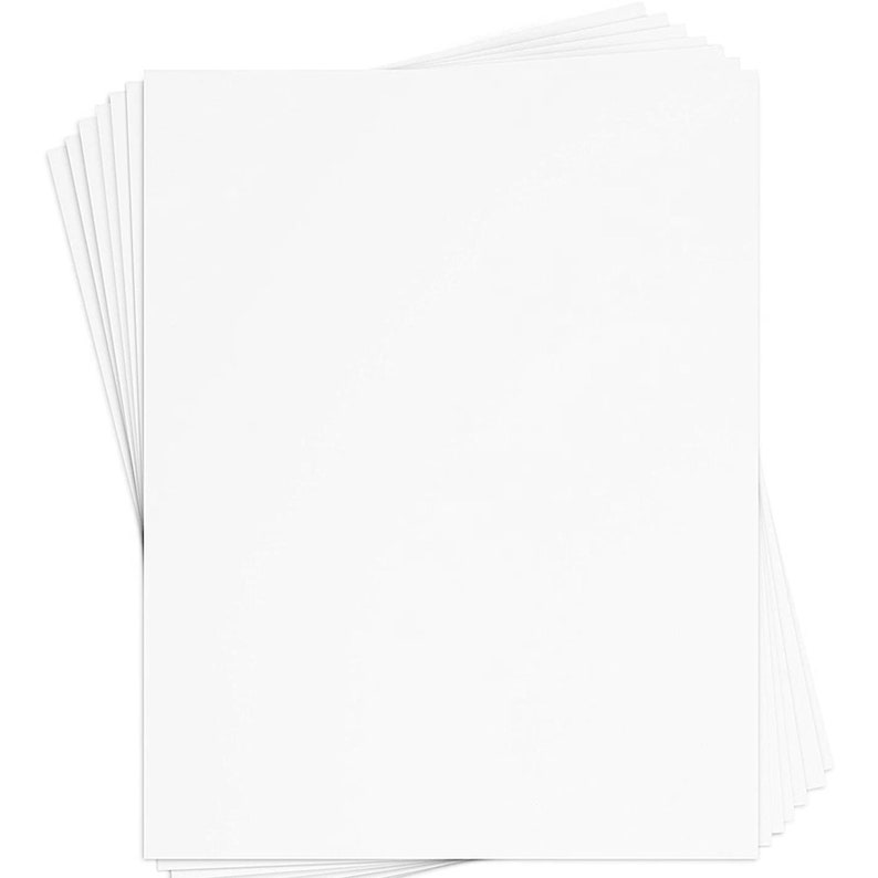 May include: A stack of white cardstock paper, perfect for crafting, scrapbooking, or other paper projects.