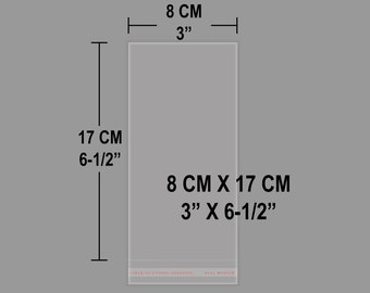May include: A clear rectangular adhesive bag measuring 3 inches by 6-1/2 inches. The bag features a bottom strip with the text LINER TO EXPOSE ADHESIVE and SEAL MASTER. The dimensions 8 CM, 3 inches, 17 CM, 6-1/2 inches, and 8 CM X 17 CM, 3 inches X 6-1/2 inches are printed.