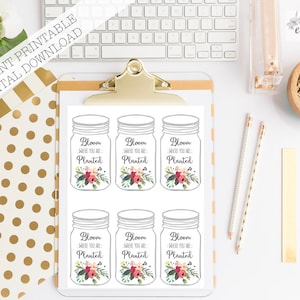 May include: Printable sheet with six mason jar images. Each jar has a floral design and the text "Bloom Where You Are Planted".