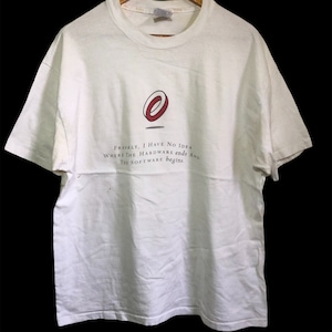 May include: White t-shirt with a red and black logo and the text "Frankly, I have no idea where the hardware ends and the software begins."