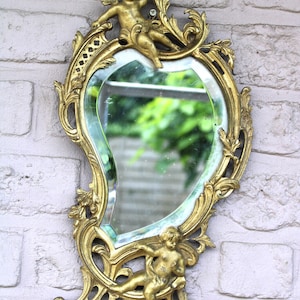 Antique bronze cherub putti figural wall mirror