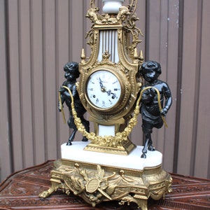 Vintage bronze marble white faun putti cherub figural mantel clock