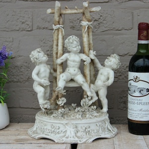 Large carlo mollica capodimonte porcelain bisque putti cherub group swing