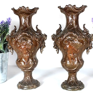 Pair spelter putti cherub figural vases