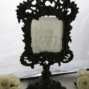 Antique porcelain lithophane in empire cast iron stand lion heads 1920&#39;s