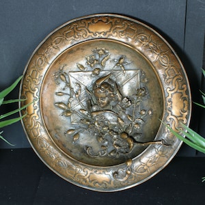 Copper embossed relief putti cherub wall round plate