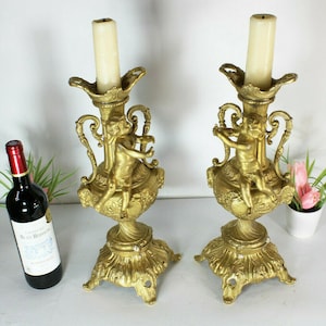 Pair bronze putti cherub candle holders ram heads candlesticks