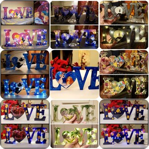 May include: A collection of 12 different "LOVE" signs, each with a unique design and a heart-shaped image in the center. The signs are made of wood and have a light-up feature. The hearts feature various Disney characters, including Mickey Mouse, Minnie Mouse, and Lady and the Tramp.