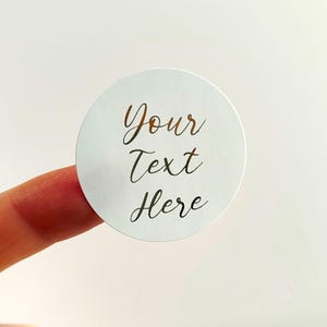 May include: A white ceramic mug with a black handle and the text "But First, Coffee" in a handwritten style. The mug is likely 12 ounces in capacity, perfect for a morning beverage.