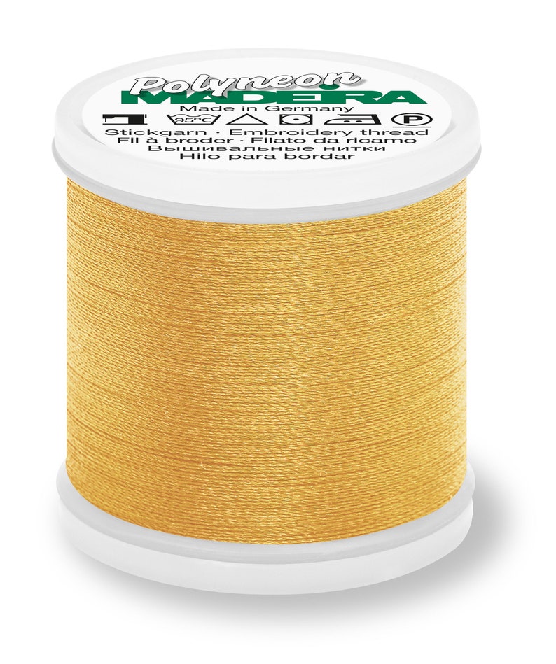May include: A spool of gold embroidery thread with the brand name "Polyneon" and the text "Made in Germany" on the label.