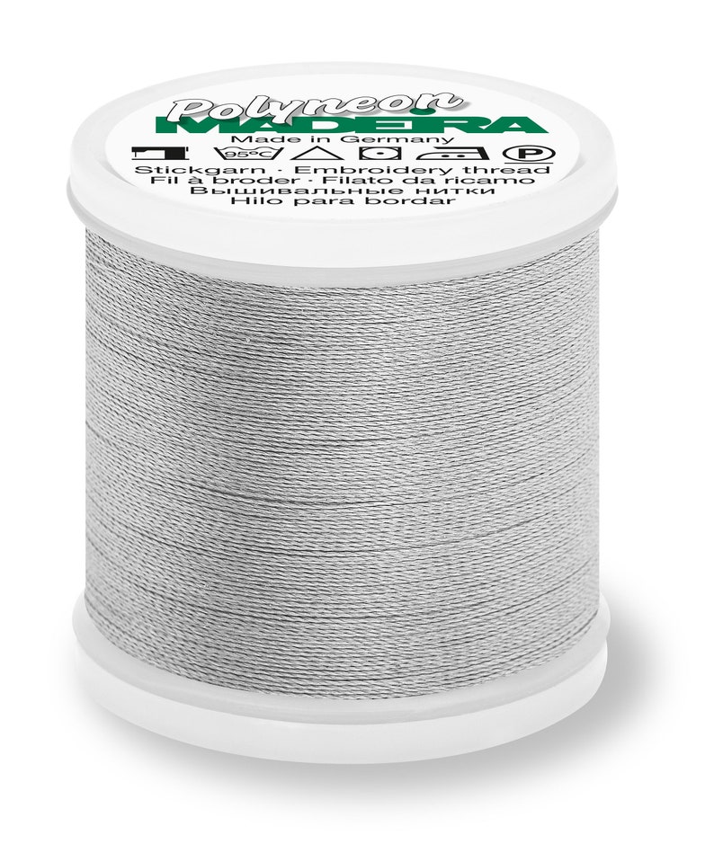 May include: A spool of gray embroidery thread with the brand name "Polyneon Madeira" and the text "Made in Germany" on the label.