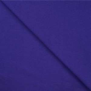 May include: Solid purple fabric swatch. The fabric has a smooth, even texture.