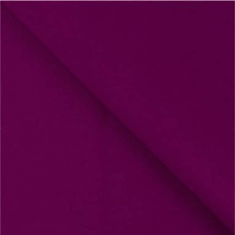 May include: A solid, deep purple fabric swatch. The fabric has a smooth, even texture.