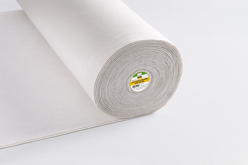 May include: A white roll of 100% cotton wadding, 1 cm thick, for quilting and crafts. The roll is labelled "100% Soft Cotton Wadding 1 cm thick".
