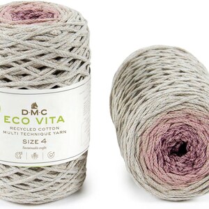 May include: A skein of DMC Eco Vita recycled cotton yarn in size 4. The yarn is a gradient colour, starting with a light beige and transitioning to a deep pink.