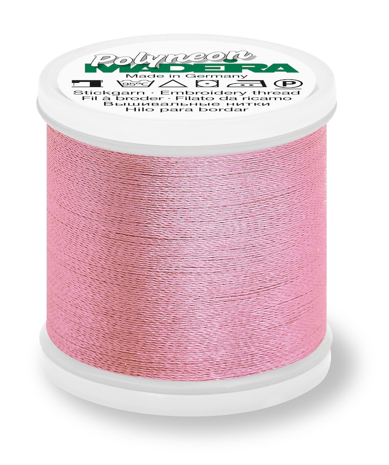 May include: A spool of pink embroidery thread labeled "Polyneon Madeira" with the text "Made in Germany" and "Stickgarn Embroidery thread".