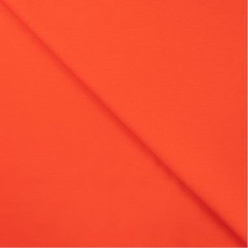 May include: Solid orange fabric swatch. The fabric is smooth and has a slight sheen.
