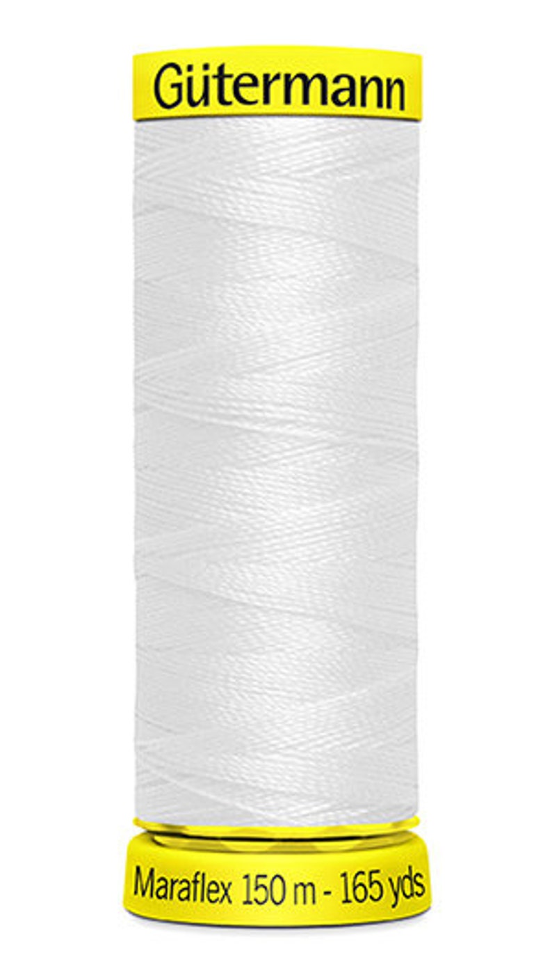 May include: A white spool of G&uuml;termann Maraflex thread with a yellow label. The label reads "G&uuml;termann Maraflex 150 m - 165 yds".