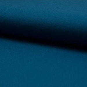 May include: A solid teal blue fabric swatch. The fabric has a smooth, slightly textured surface.