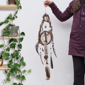 dream catcher orb with brown and blue stones