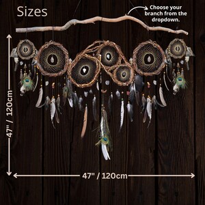 May include: A large wall hanging featuring five circular woven hoops suspended from a natural branch. The hoops contain intricate webbing, crystals, and dangling feathers, including peacock feathers. Text reads: Sizes, 47" / 120cm, Choose your branch from the dropdown.