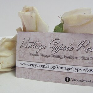 May include: A business card with the text "Vintage Gypsie Rose" and the website address "www.etsy.com/shop/VintageGypsieRose". The card is decorated with a floral pattern and has a Facebook icon with the text "VintageGypsieRose".