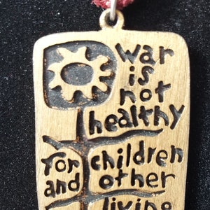 War is Not Healthy for Children and Other Living Things Pendant