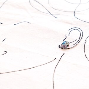 a drawing of a woman's face and ear