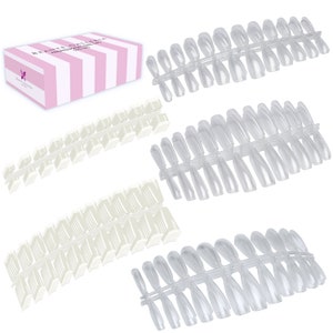 May include: A set of clear plastic false nails in three different sizes. The nails are arranged in rows and are ready to be used for a manicure.