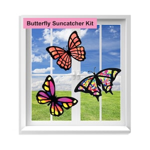 May include: Butterfly Suncatcher Kit with three colorful butterflies, one orange, one pink and one multi-colored, on a window.