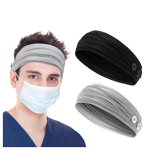 May include: Two headbands with buttons on the side. One headband is gray and the other is black.