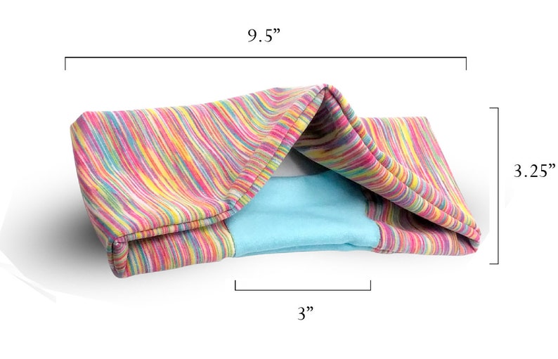 May include: A colorful striped fabric cat bed with a blue lining. The bed measures 9.5 inches long, 3.25 inches high, and 3 inches wide.
