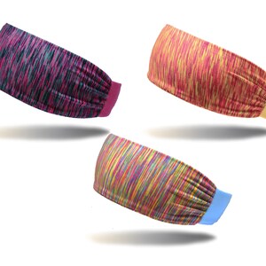 May include: Three colorful headbands with different patterns. The first headband is pink and black, the second is yellow and red, and the third is rainbow.