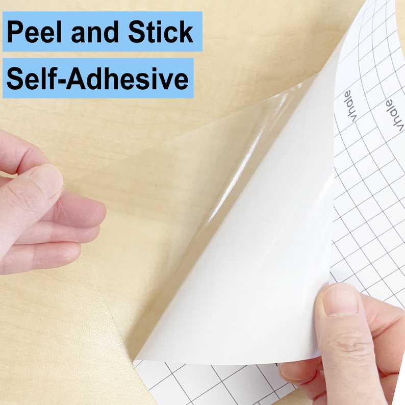 May include: A white sheet of self-adhesive paper with a grid pattern is being peeled back to reveal the clear adhesive backing. The text "Peel and Stick Self-Adhesive" is visible at the top of the image.