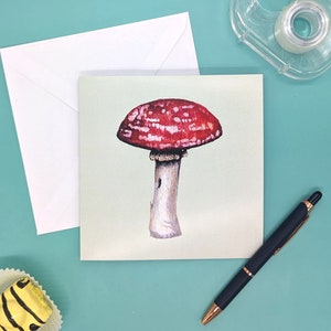 Carte de voeux vierge représentant un champignon représentant un champignon aquarelle