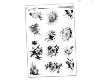 May include: A sheet of 12 black and white grunge spiderweb stickers. The spiderwebs are in various styles and sizes, with some having a watercolor effect.