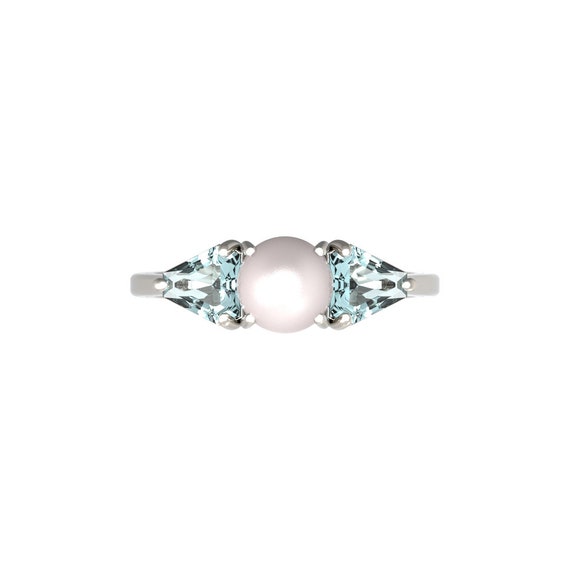 Pearl and store aquamarine ring