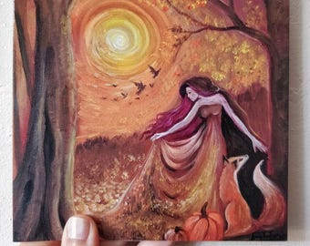 May include: A painting of a woman with long red hair in a flowing orange dress standing in a forest with a fox and pumpkins. The background is a sunset with a yellow sun and birds flying in the sky.