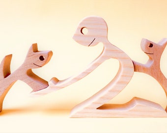 one man two cats; wood carving