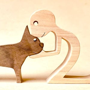 a man a bulldog; wooden sculpture