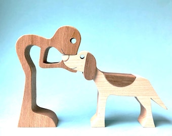 a man has a springer spaniel; original wood sculpture 2virgule5d