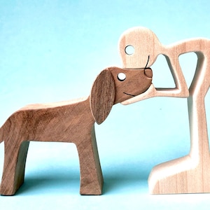 a man a dog version 3; original wood sculpture 2virgule5d