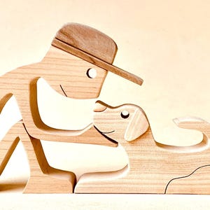 a seated man a lying dog; original wood sculpture 2virgule5d