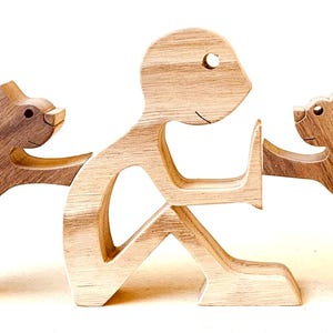 A man with two Boston terriers; original wood sculpture 2.5d