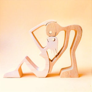 couple; a man a woman; wood sculpture