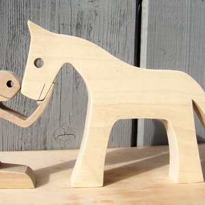 a man a horse; wood carving