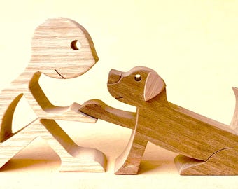 A man and a black Labrador, 2026; original wood sculpture, 2.5d