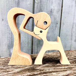carved wooden sculpture; a man and a dog, version 2