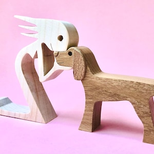 a woman a dog version 5; wood carving